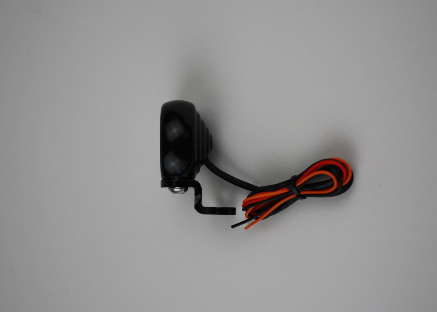 A black Prism Supply Co. Ripple Tail Light with dual function LED lights, showing mounting bracket and wires