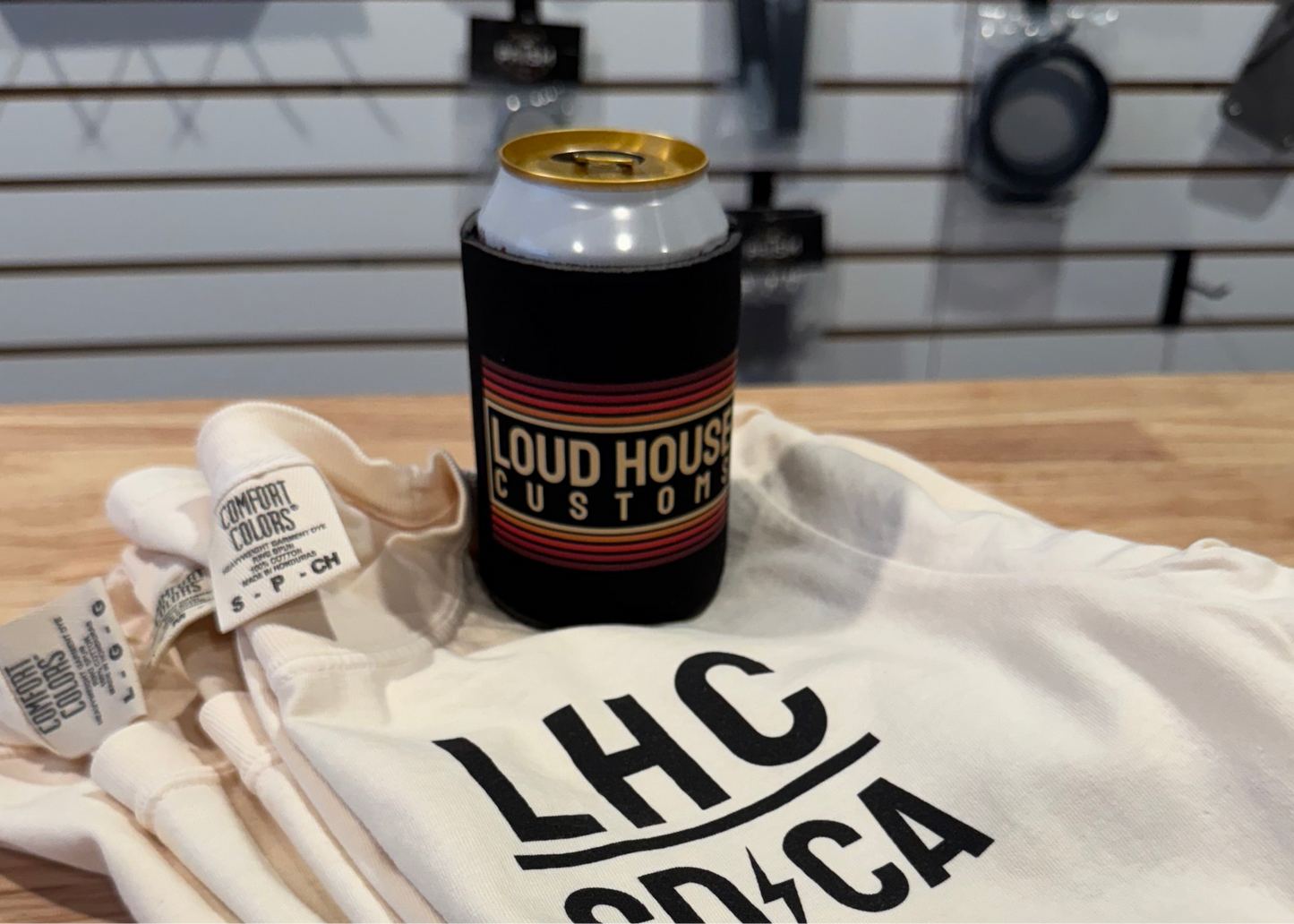 Can cooler with 'Loud House Customs' branding on a white shirt with 'LHC' logo.